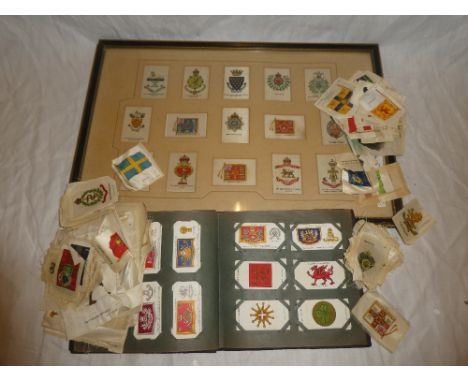 A framed display of silk cigarette cards - Military Badges; various loose silk cigarette cards and an album of a various ciga
