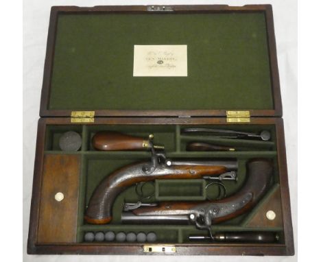 A pair of 19th Century Irish  percussion overcoat pistols by W &amp; I Rigby of Dublin with 4½" barrels, engraved steel locks