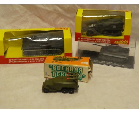 Two mint and boxed Solido military vehicles including Panther tank and half track; Russian boxed missile launcher and one oth