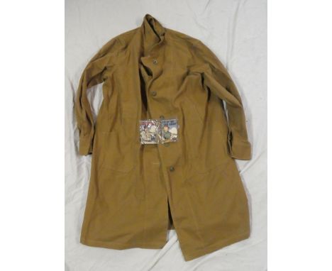 An original Second War woman's Land Army Khaki overall coat dated 1943, Life in the Land Army booklet and one other small boo