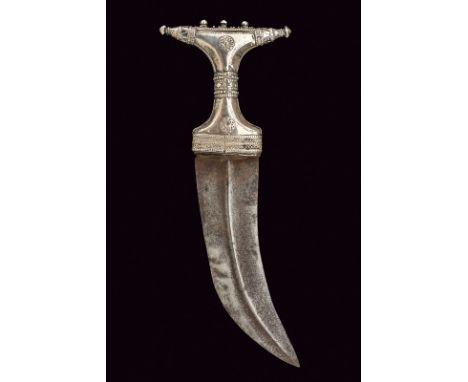 dating: late 19th Century provenance: Yemen, Wide, curved, single-edged blade with raisers at the center. 'T'-shaped, silver 