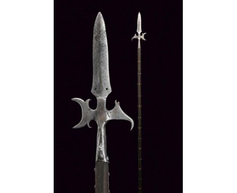 dating: 18th Century provenance: Europe, Double-edged cusp with double hole at the base, small axe with wings at the base and