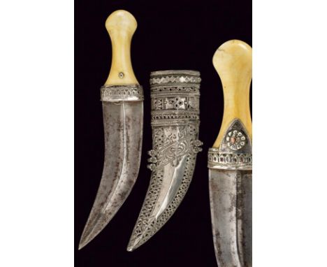 dating: circa 1900 provenance: Oman, Curved, double-edged blade with central raiser; ivory grip, drop-embossed with silver, p