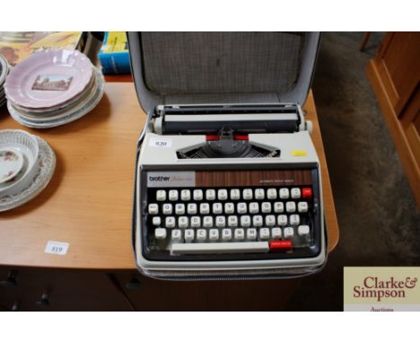 A Brother Deluxe 1350 typewriter in carrying case 