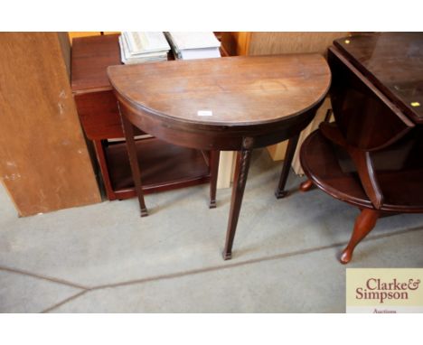 A mahogany demi-lune card table 