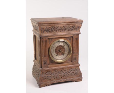 Late 19th Century carved oak mantle clock
With a 13cm silvered dial with Arabic numerals, the two train movement number 54969