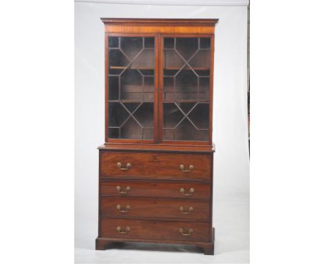 An early 19th Century inlaid mahogany and satinwood crossbanded secretaire bookcase
With a cavetto cornice above a satinwood 