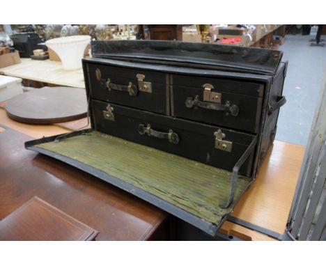 A vintage car trunk
With a hinged top above a fall front indistinct owners registration mark enclosing a hinged case, with pl