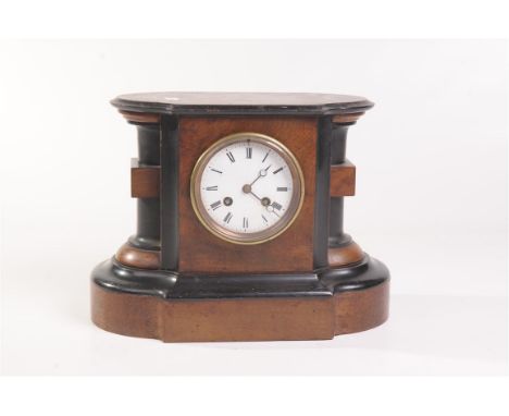 A Victorian walnut ebonised mantle clock
With a 9cm white enamel dial with Roman numerals, the two train eight day movement w