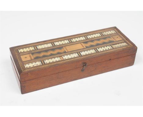A Victorian walnut and marquety inlaid cribbage box
The hinged cover with bone panels, the centre inlaid with inlaid sectiona