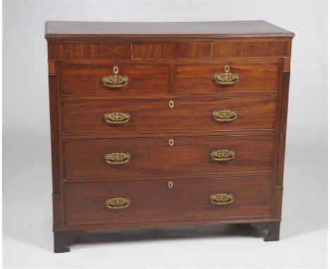 An early 19th Century inlaid mahogany chest of drawers
The rectangular crossbanded and chequer inlaid top with a moulded bord