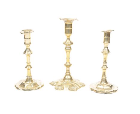 A pair of 18th Century petal base brass candlesticks
With mushroom knopped baluster stems 20cms and an 18th Century brass pet
