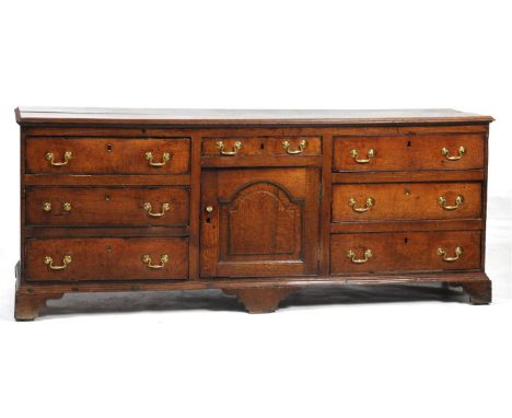 A good George III oak dresser base
Probably Lancashire, the rectangular moulded 2cm thick two plank top above a frieze drawer