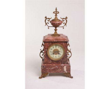 A rouge marble and gilt metal mantle clock, late 19th Century
With a 9.5cm white dial with Arabic numerals, hairline crack, t