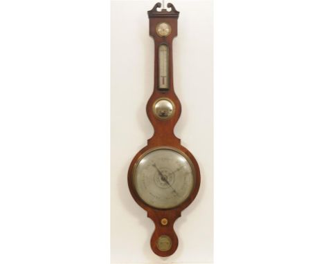 An early 20th Century mahogany cased wheel barometer
With a 25cm silvered register above a hygrometer, thermometer, mirror an