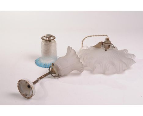 An Edwardian opaque glass and blue tinted bell shape shade
13cms, an Edwardian opaque glass bell shaped on a metal stand with