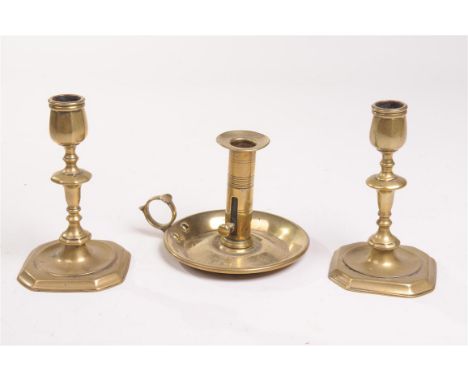 A pair of 18th Century turned brass taper sticks
Each with canted square bases rising to knoped octagonal vase shape candle h