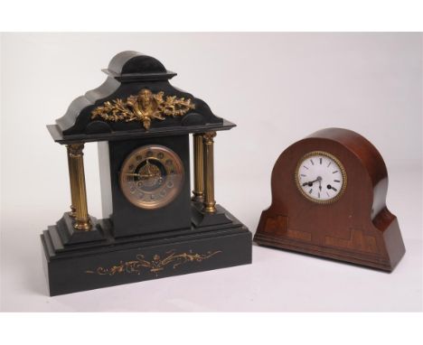 A Victorian black slate and gilt metal mantle clock
With a 9cm dial with Arabic numerals, the two train movement striking on 