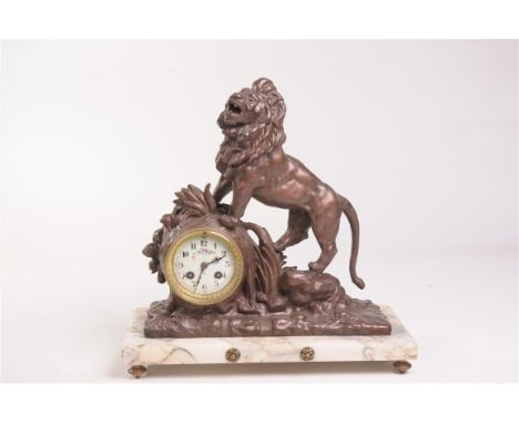 A French patinated spelter and variegated marble mantle clock
With a 8cm white dial painted with blooms, the two train eight 