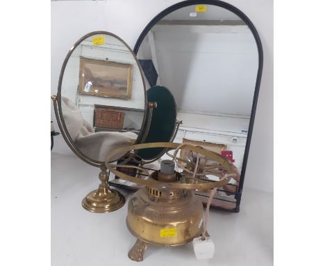 A modern black framed, arched mirror with incorporated shelf together with a brass dressing table swing mirror and a Calorifi
