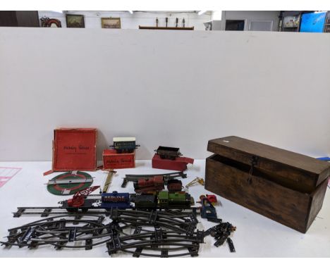 A collection of tin plated early 0 gauge Hornby series model railway accessories to include a boxed turntable, a LNER 8851 en