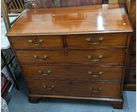 A George III mahogany chest of two short and three graduating long drawers, standing on bracket shaped feet, 91.5cm x 98.5cm 
