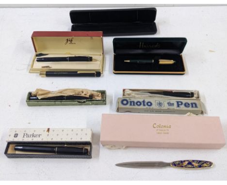 Mixed writing equipment to include a boxed De La Rue Onoto fountain pen, a letter opener with an enamel design depicting biro