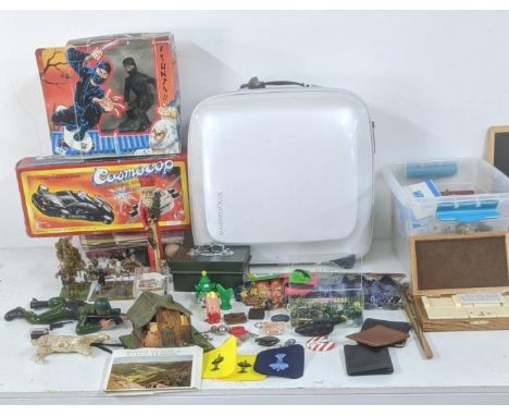 A mixed lot include Casmo cop toy car and others together with marbles to include Victorian examples brass door nob fittings 