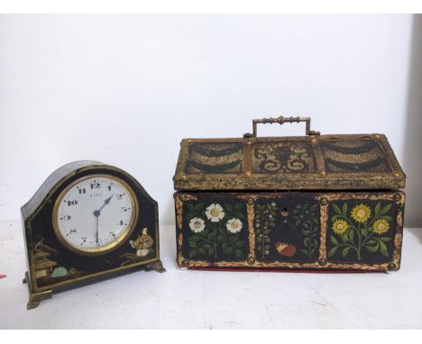 A mid Victorian painted wooden cabinet, painted floral panels bordered by gilded and painted leather and studwork, domed lid 