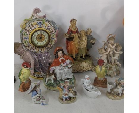 A mixed lot of figural ornaments to include an Italian mantel clock and othersLocation:If there is no condition report shown,