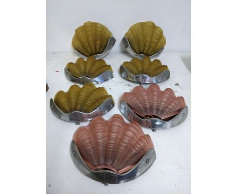 A group of seven Art Deco glass clam shell wall lights in chrome plated fixings Location: If there is no condition report sho