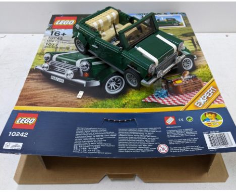 A Lego creator set No 10242 green Mini Cooper, part completed, set assumed to be complete, with original box and instructions