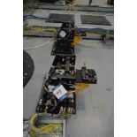 Set of eight robot tool stands with pneumatic attachments