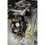 Set of eight robot tool stands with pneumatic attachments