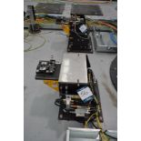 Set of eight robot tool stands with pneumatic attachments