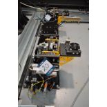 Set of eight robot tool stands with pneumatic attachments