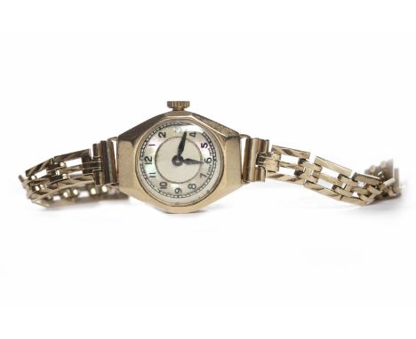 LADY'S MID TWENTIETH CENTURY NINE CARAT GOLD WRIST WATCHconverted to quartz, the round mother of pearl dial with Arabic numer