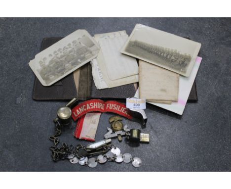 Leather wallet of letters, First World War postcards etc and a quantity of whistles and badges, LMS whistle, Lancashire Fusil