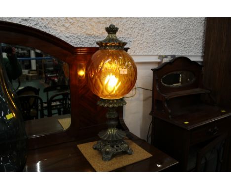 Decorative table lamp with metal base and top and orange glass shade, height approx 65 cm