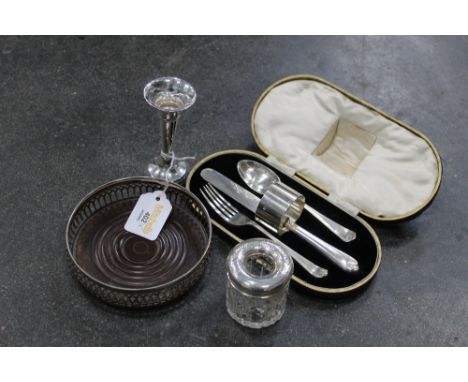 Cased knife, fork, spoon and serviette ring set, silver bud vase, dressing table jar and wine bottle coaster 