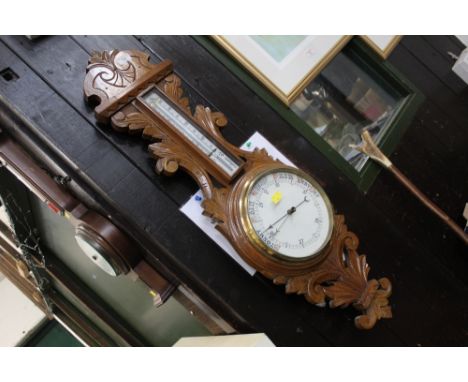 Late 19th/early 20th century barometer with carved oak frame