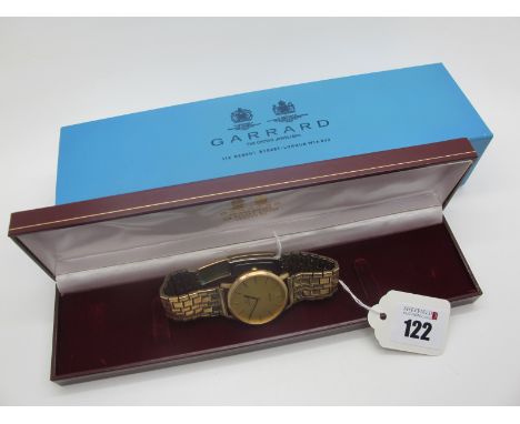 Garrard; A 9ct Gold Cased Quartz Gent's Wristwatch, the signed dial with line markers, the case back engraved "Blue Circle In