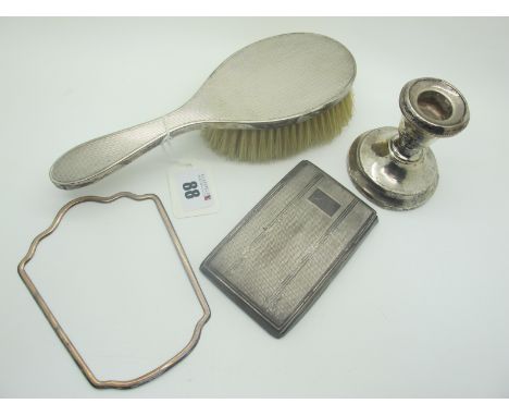 A Hallmarked Silver Backed Hair Brush, with engine turned decoration, together with a hallmarked silver dwarf candlestick (de