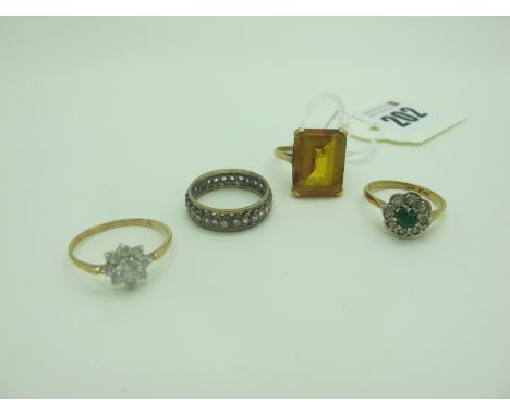 A Large 9ct Gold Single Stone Dress Ring, (finger size N); two cluster rings and an eternity band. (4) 