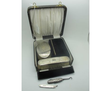 A Hallmarked Silver Backed Brush Set, with engine turned decoration, in original fitted case (incomplete); a folding pocket k