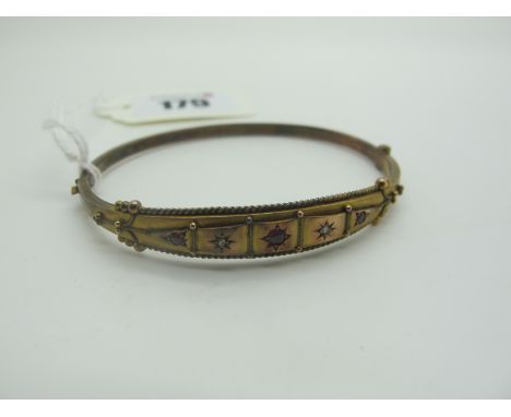 A Chester Hallmarked 9ct Gold Hinged Bangle, graduated star set to the front with diamond chip highlights, Chester 1905 (5.5g