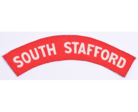 WW2 Printed South Staffordshire Regiment Shoulder Title, white lettering on red backing. Glue residue to the reverse. 