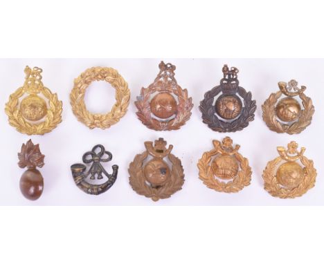 Selection of Royal Marines Cap Badges, including gilded wreath with lug and pin fitting from the glengarry badge, strung bugl