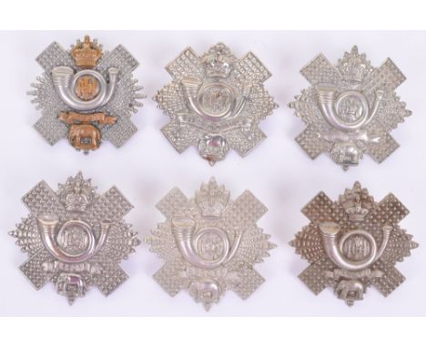Six Cap / Glengarry Badges of the Highland Light Infantry (HLI), including NCO's multi-piece example, white metal Victorian, 