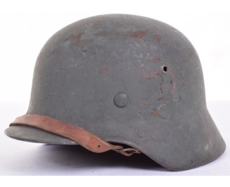 WW2 German Army M40 Pattern Steel Combat Helmet, which has had a dark green over paint finish applied to the shell (possibly 